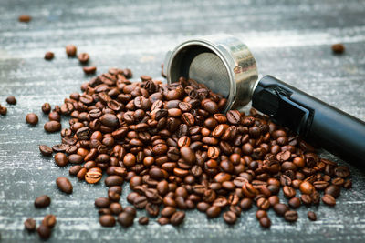 Close-up of roasted coffee beans on table