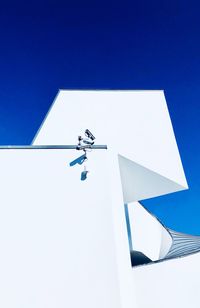 Low angle view of built structure against clear blue sky