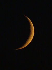 Low angle view of moon against sky at night