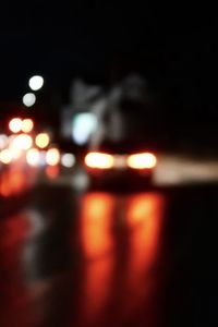 Defocused image of illuminated city at night