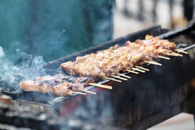 Close-up of meat on barbecue grill