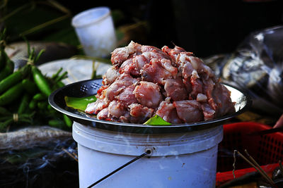 Close-up of meat in container