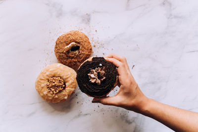 Cropped hand of person holding food