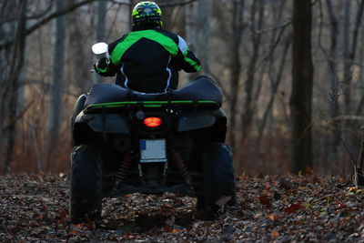 Man riding motorcycle on field