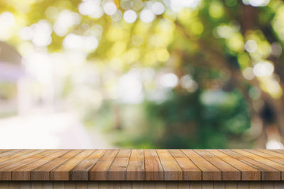 Close-up of wooden railing on table in park