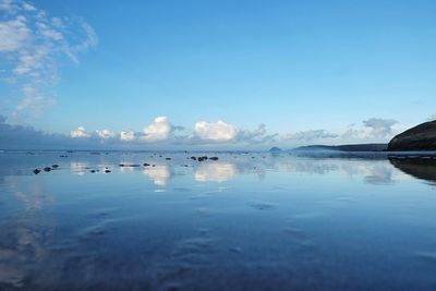 Scenic view of sea against blue sky