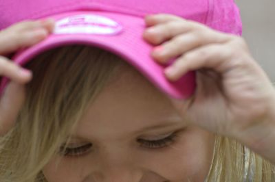 Close-up of girl wearing pink cap
