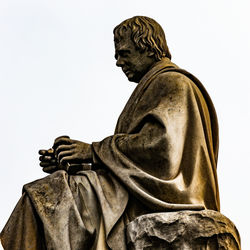 Low angle view of statue against sky