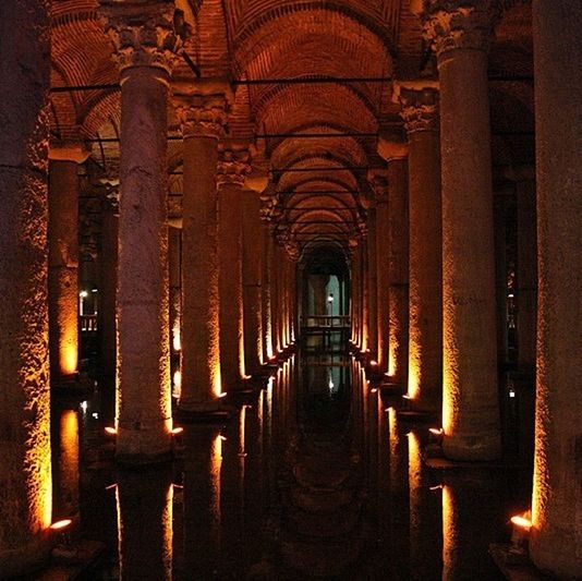 indoors, architecture, built structure, arch, architectural column, the way forward, column, in a row, diminishing perspective, colonnade, corridor, history, empty, illuminated, place of worship, religion, interior, pillar, travel destinations, no people