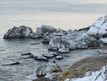 Rocks on sea shore during winter