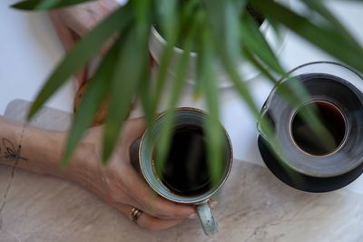 Close-up of hand holding drink