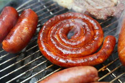 Close-up of sausage on barbecue grill