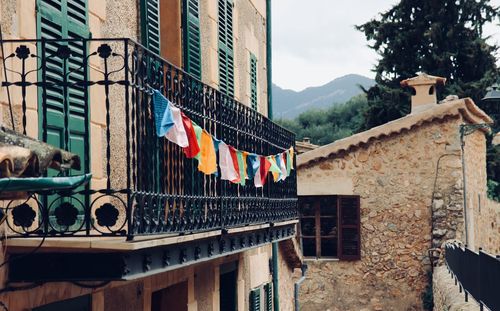 Clothes drying against buildings in city