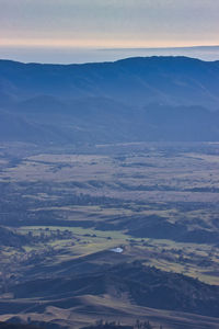 Aerial view of landscape against sky during sunset