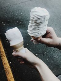 Cropped image of hand holding ice cream