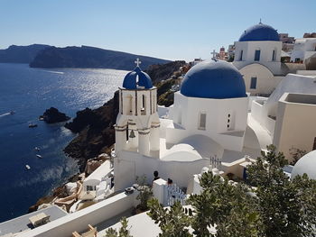 High angle view of church against blue sky