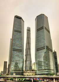 Low angle view of buildings in city against sky