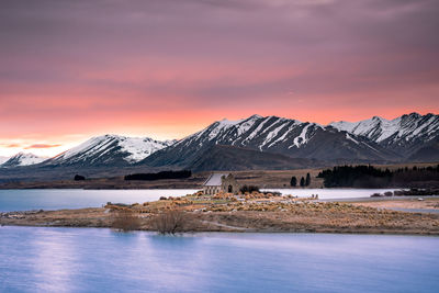 Sunrise view of the church of good shepherd with beautiful snow capped mountain range. 