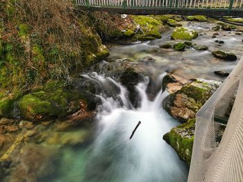 River flowing through rocks in forest