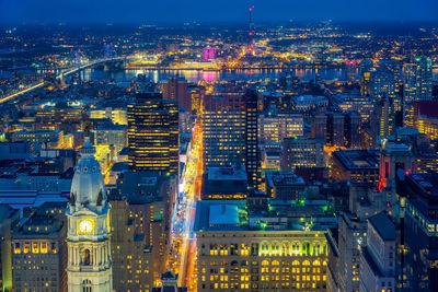 High angle view of illuminated buildings in city at night