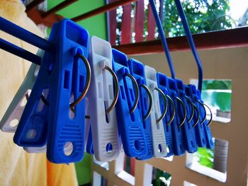 Close-up of clothespins on clothesline