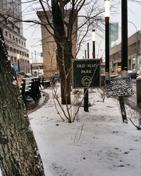 Road sign in front of building