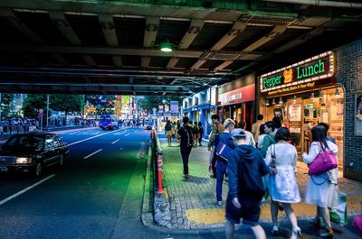 People on city street at night