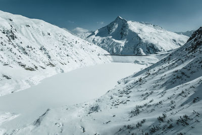 Aerial view at frozen mountain lake above gastein valley, salzburg, austria