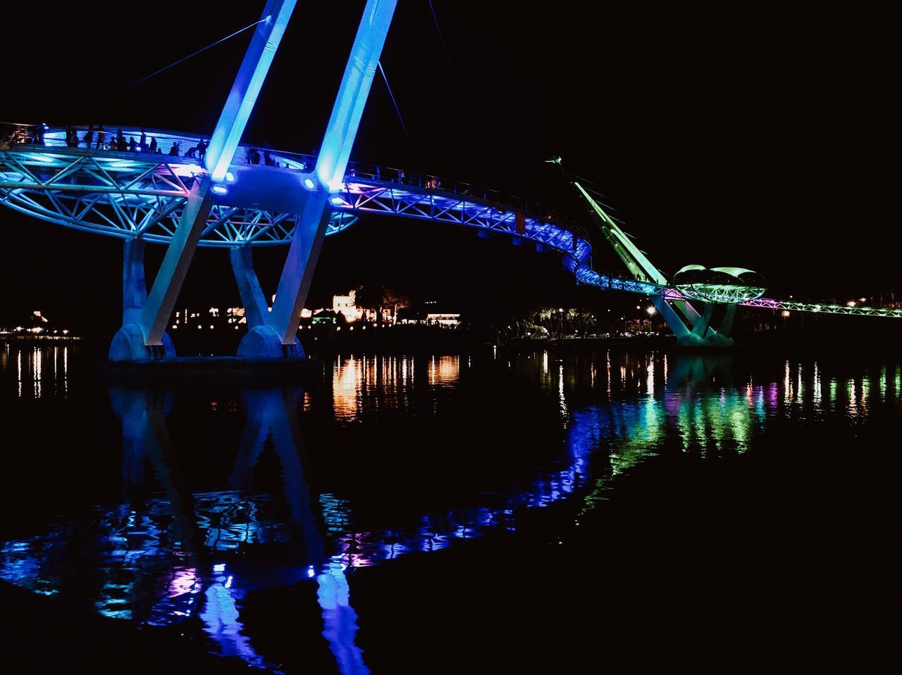 ILLUMINATED BRIDGE AT NIGHT