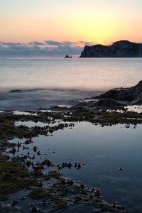 Scenic view of sea against sky during sunset