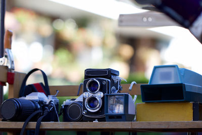 Close-up of vintage cameras for sale at market