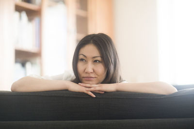 Young woman at home in a living room