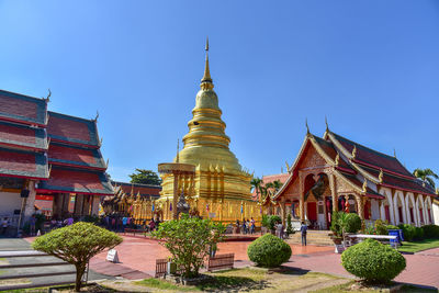 View of temple against buildings