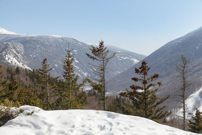 Scenic view of snow covered mountains against sky