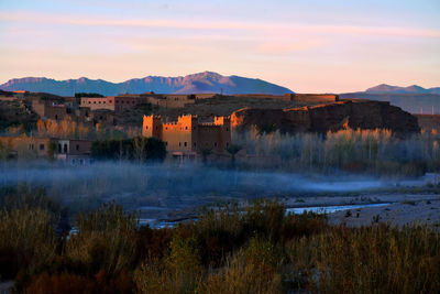 Panoramic view of buildings against sky during sunset