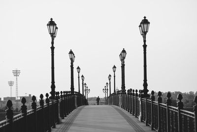 Street lights against clear sky