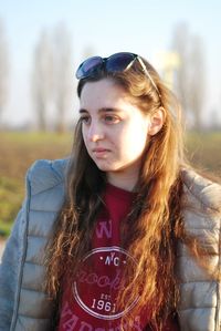 Portrait of smiling young woman standing outdoors