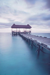 Pier over sea against sky