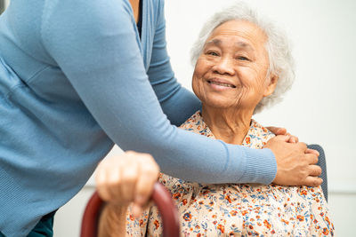 Low angle view of woman holding hands