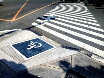 High angle view of arrow symbol on road