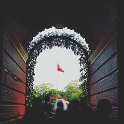 Low angle view of flags in tunnel