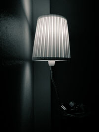 Close-up of electric lamp at home