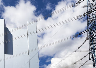Low angle view of cables against sky