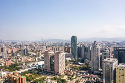 High angle view of buildings in city against sky