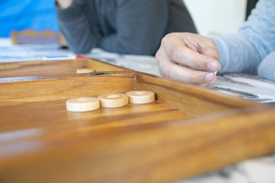 Midsection of man playing leisure game 