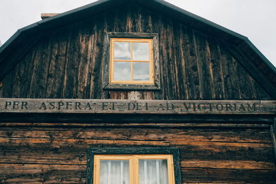 Low angle view of window on old building