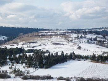 Scenic view of snow covered landscape against sky