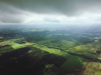 Aerial view of agricultural field against sky