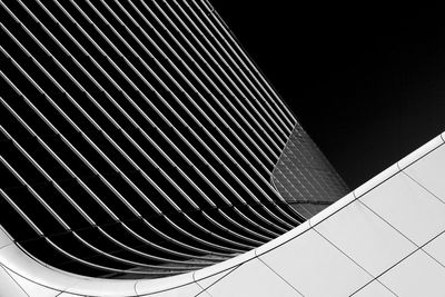 Low angle view of modern building against sky at night