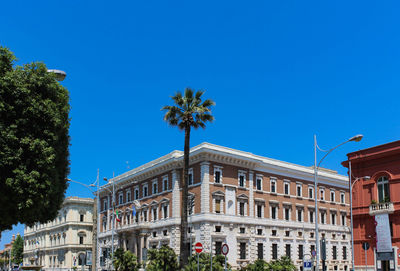 View of buildings against blue sky
